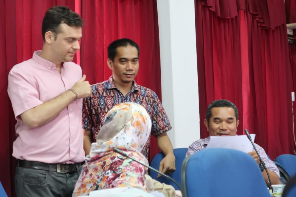 Micah Fisher and Dr Alif Sahide assisted participants with their works